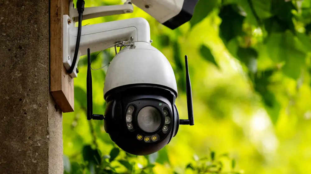 Outdoor PTZ security camera mounted on a wall